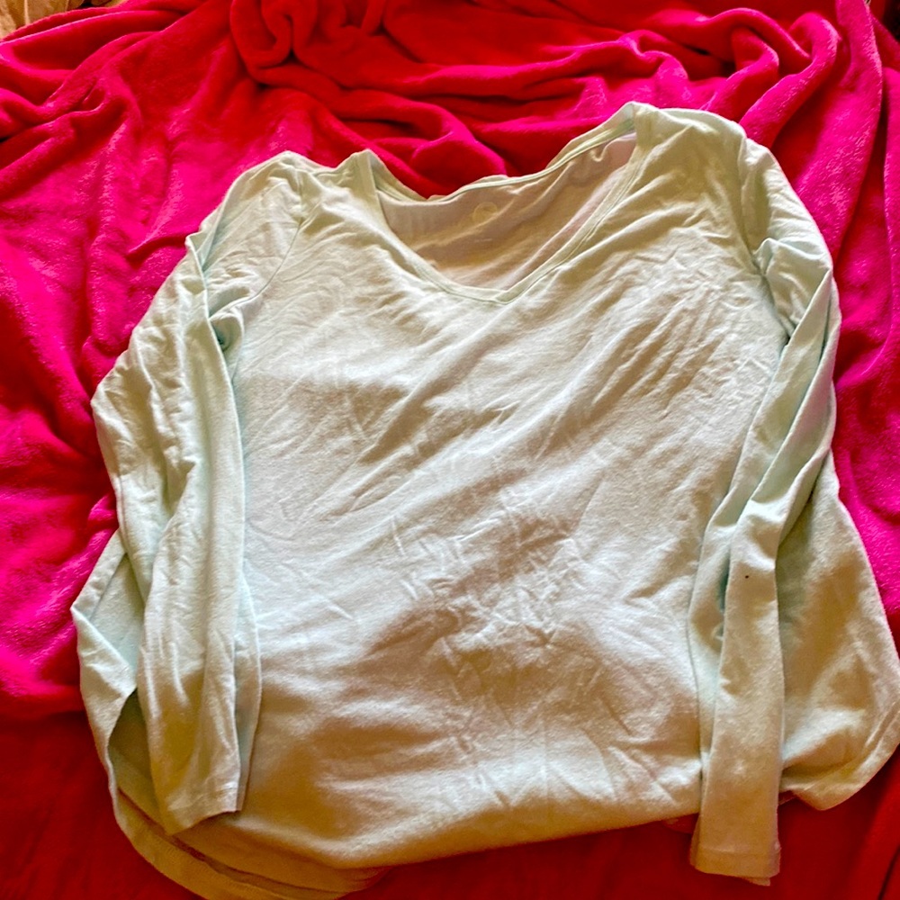 So brand light weight mint green long sleeve top. Has a little sparkle size XL